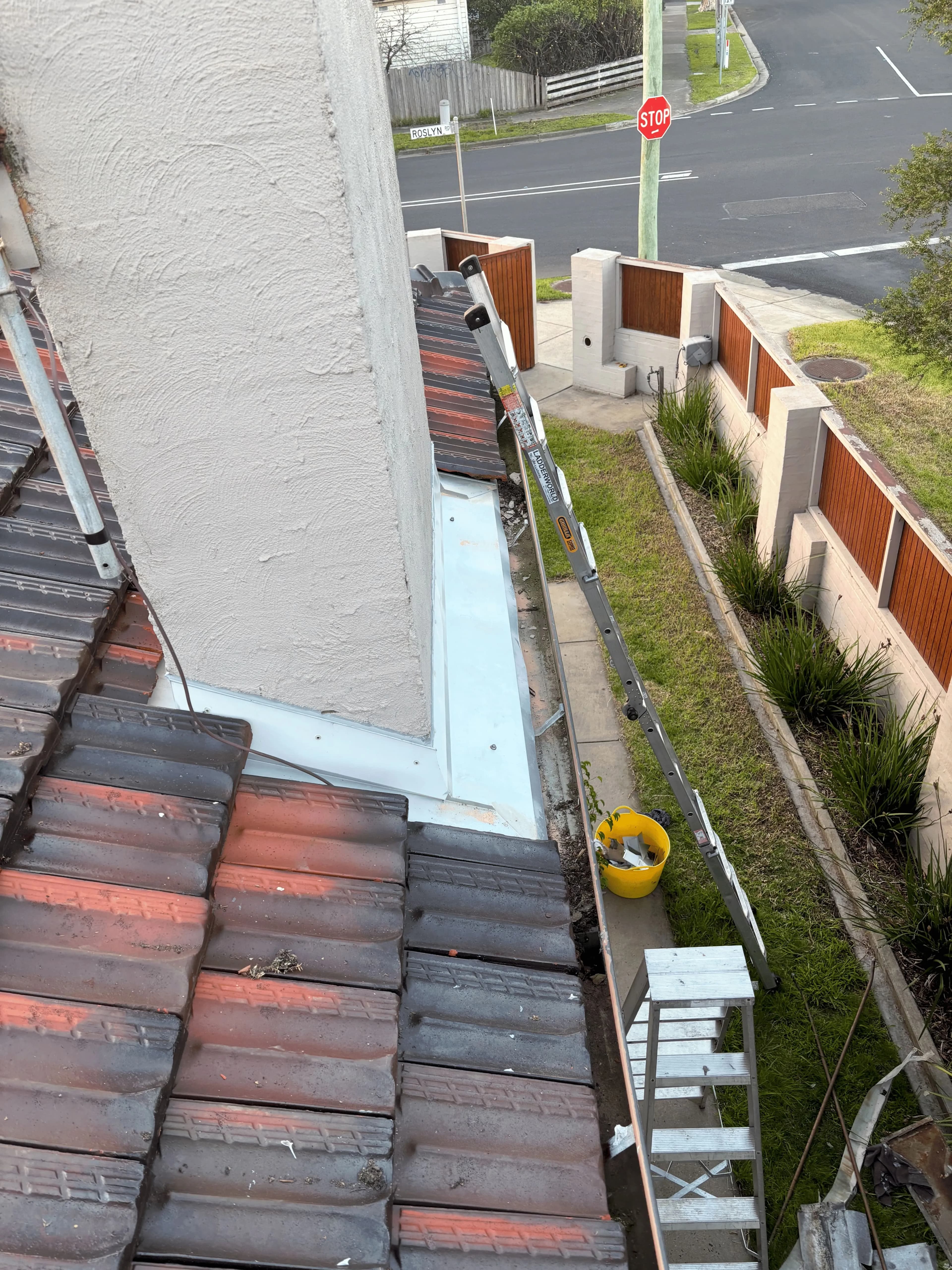 New chimney flashing installation on tile roof