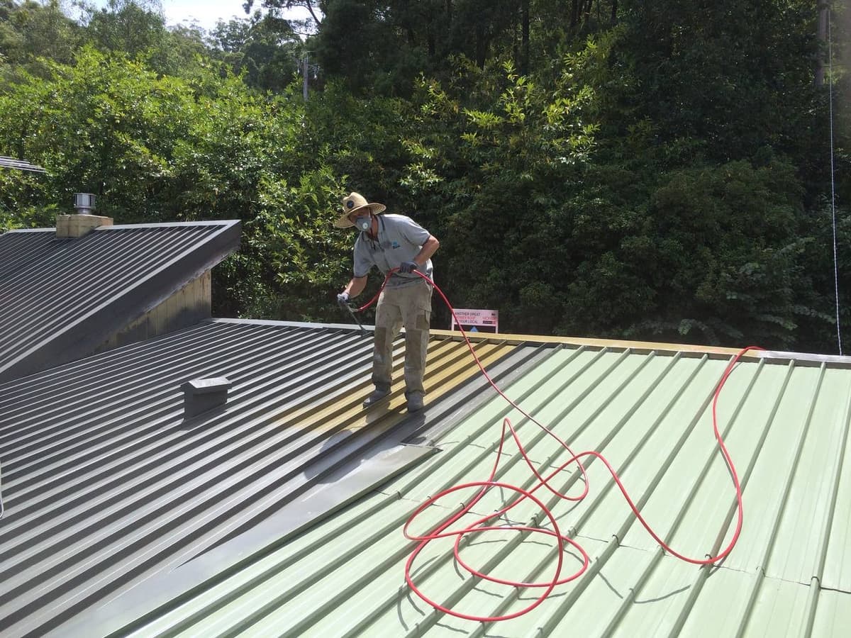 Metal roof spray painting in progress Geelong – Skyways Roofing