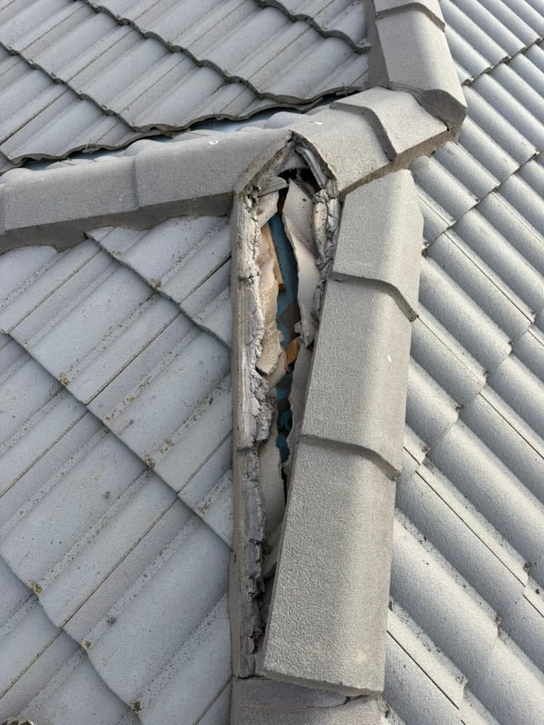 Cracked ridge cap tile roof damage Geelong – Skyways Roofing