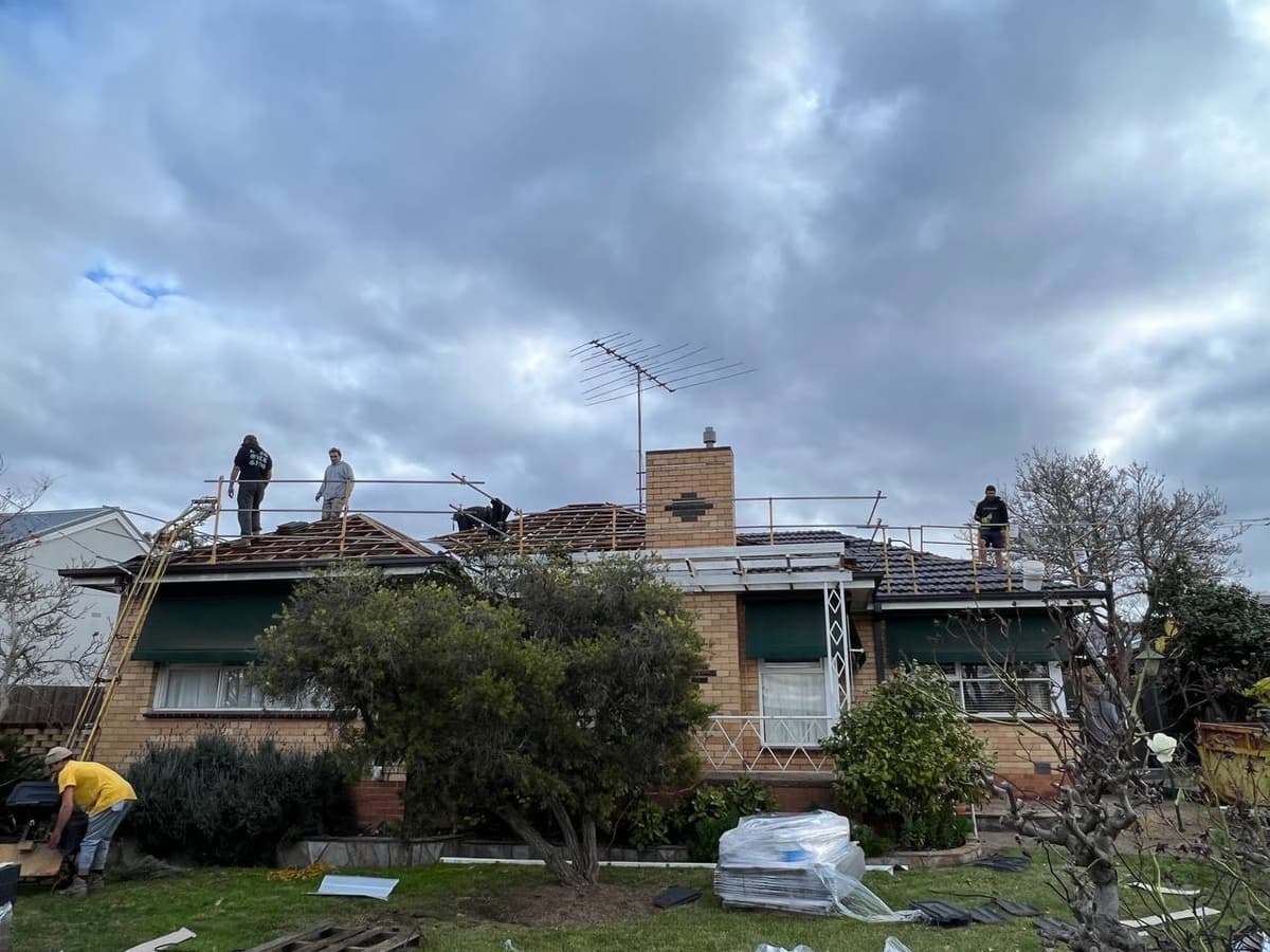 Re-roofing team at work with gutter removal Geelong – Skyways Roofing