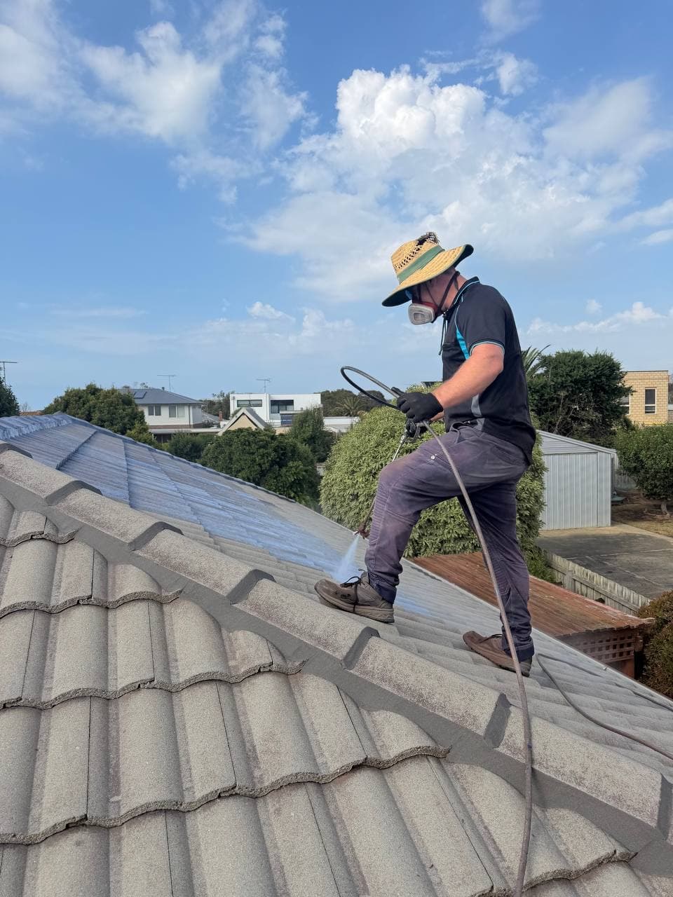 Roofer applying sealant to tile roof Geelong – Skyways Roofing